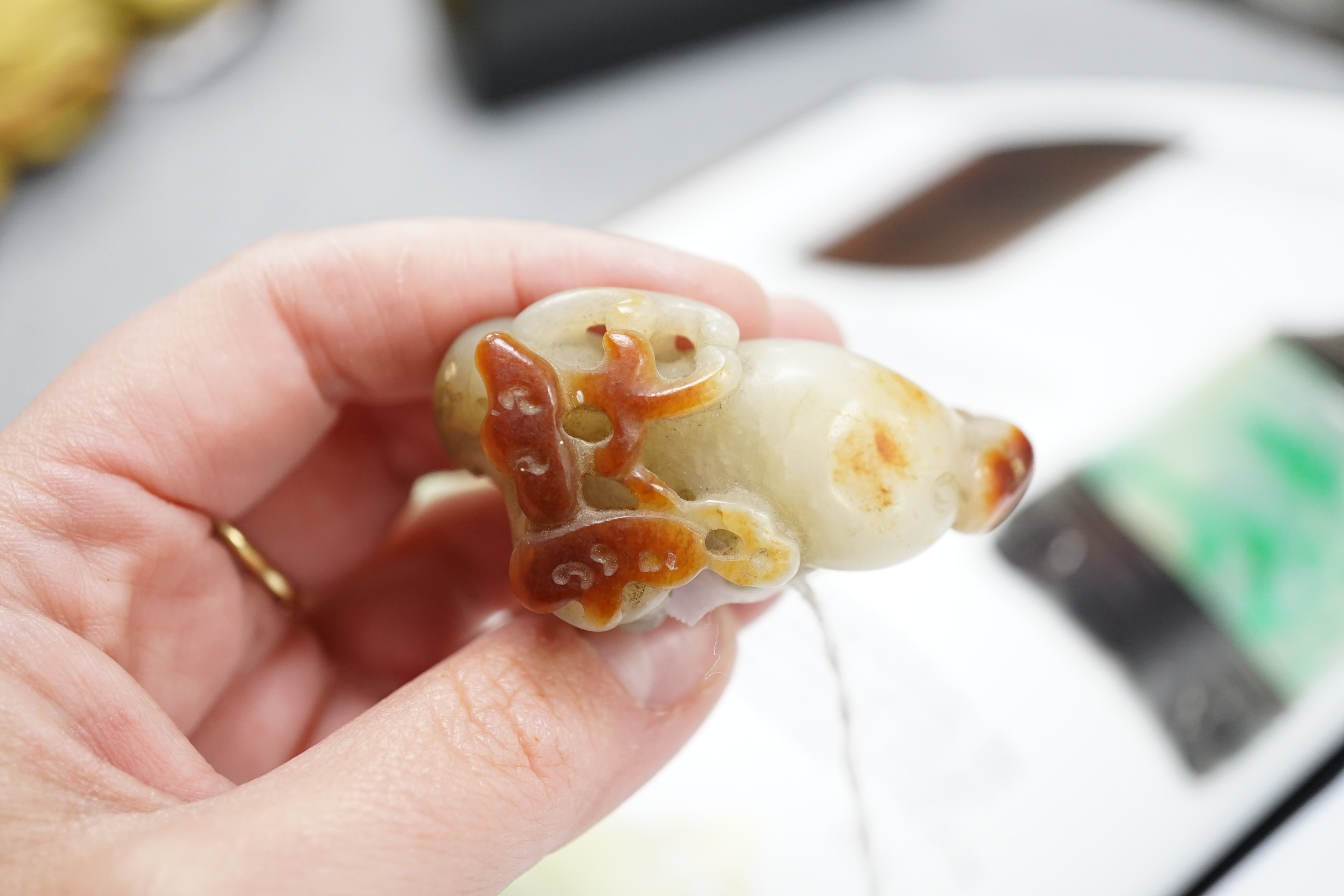 A Chinese pale celadon and russet skin jade figure of a stag, 19th century
